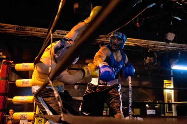 
	Will Cappella (l.) is knocked into the ropes by Gregg Bounavita, who prevailed in the 201-pound novice bout Tuesday in Flushing at the Daily News Golden Gloves.
